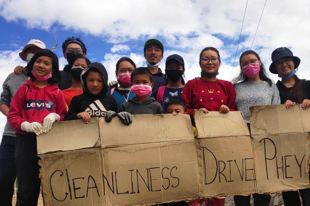 Children holding a placard about saving the environment_environmentalist in Leh