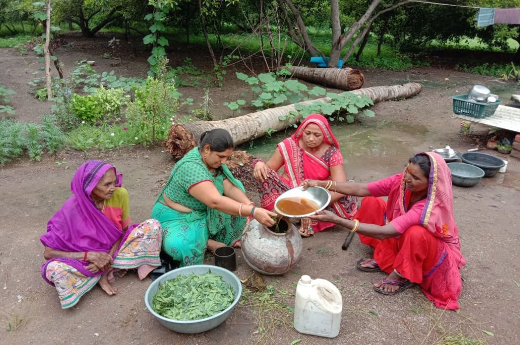 Women preparing organic growth promoters