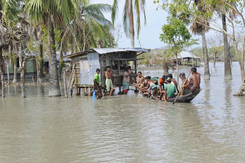 People in a boat during a flood, climate change