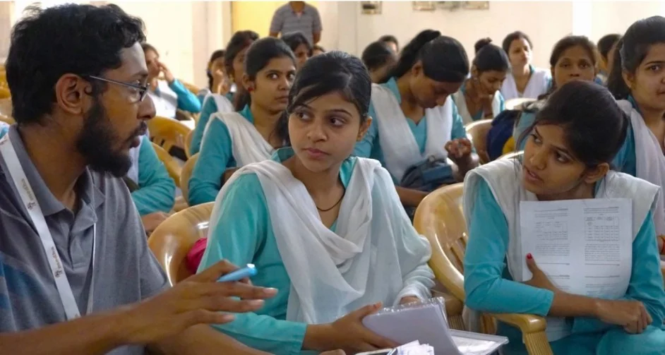 A representative from Medha speaking with students_randomised control trial