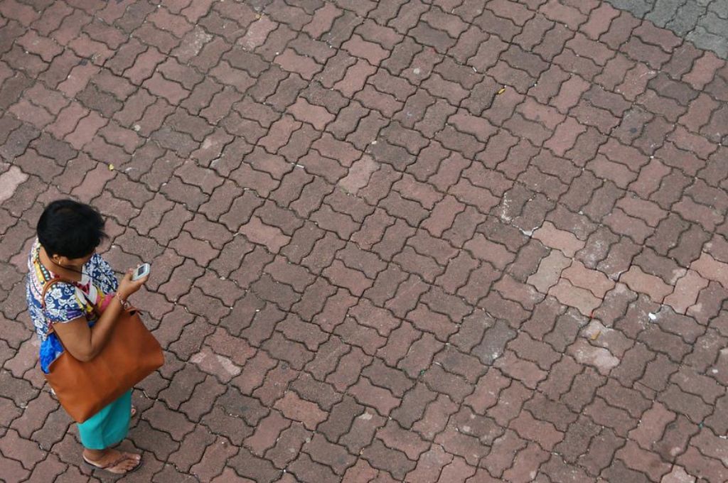 woman using phone on the road-social media