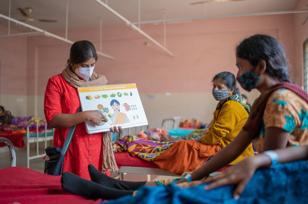 A woman teaching another woman--public healthcare