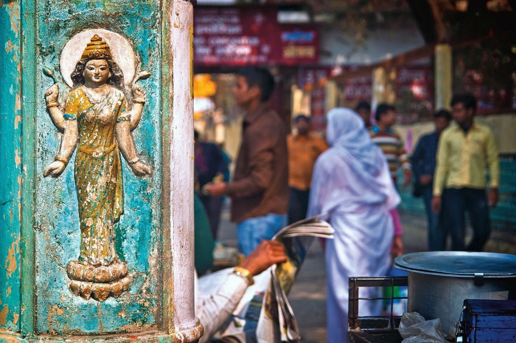 goddess laxmi engraved in a pillar in a busy market_gender-based-violence