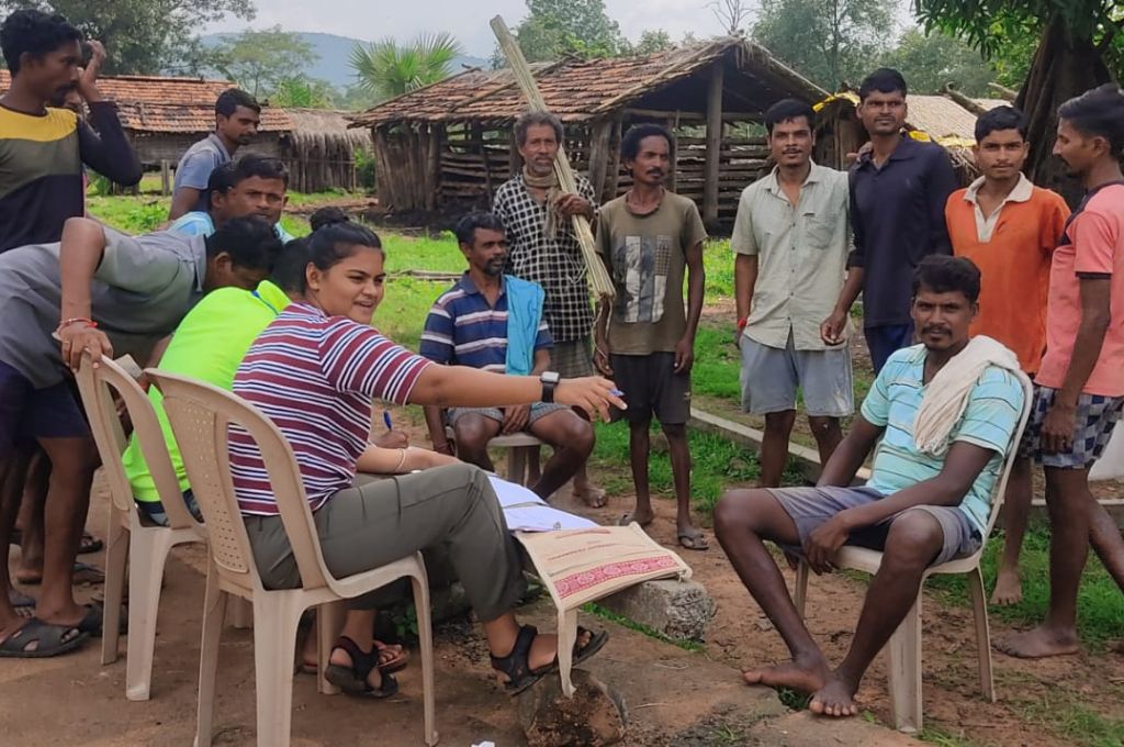 bhagyashri discussing issues with people from her community-Adivasi 