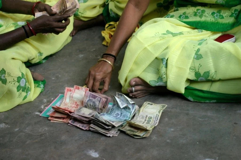 women in sarees counting money-budget 2023