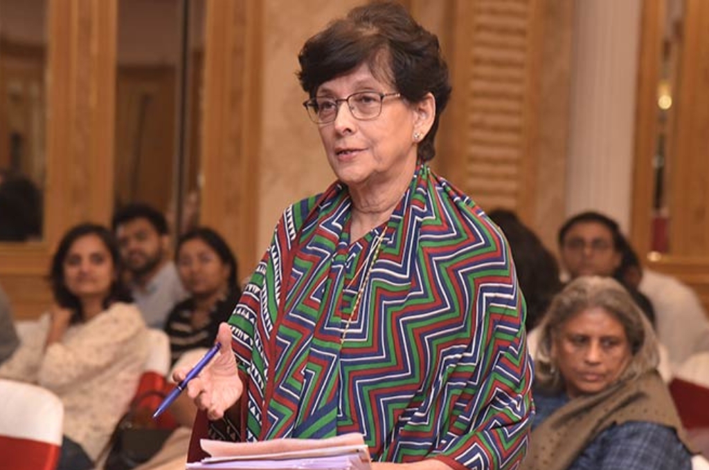 A woman holding a sheaf of papers and a pen--Maja Daruwala