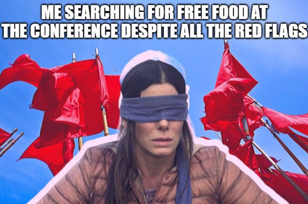 A blindfolded woman surrounded by red flags with the image saying me searching for free food at the conference despite all the red flags_nonprofit humour