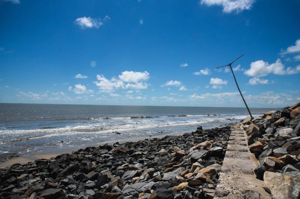 Beach and shore showing devastation after cyclone Yaas with debris everywhere_livelihood of fishing community