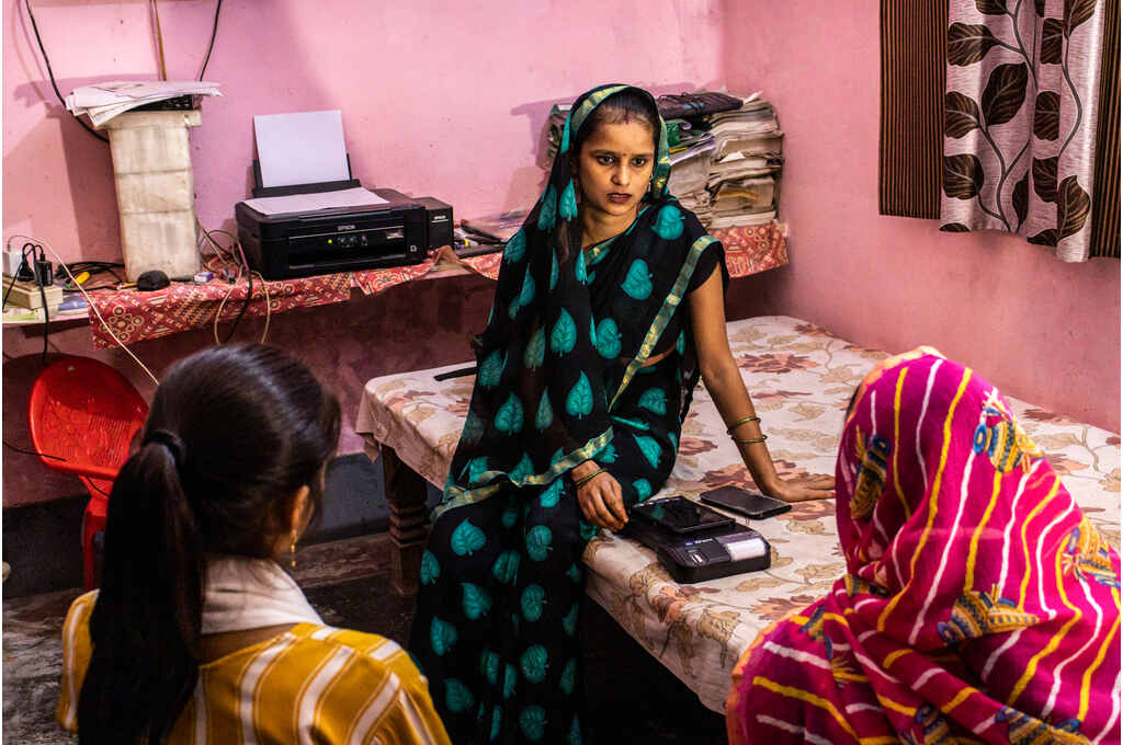 A BC sakhi speaking with two other women_financial inclusion