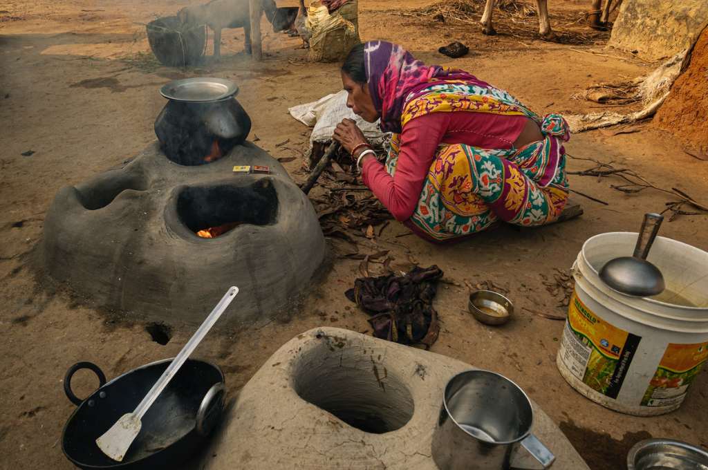 a woman cooking in an outdoor kitchen--hunger gap