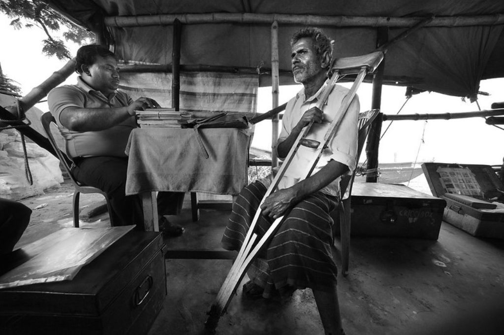 old  man with disability sitting on a chair-disability budget