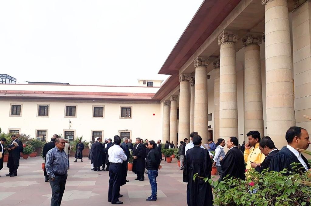 a large group of people, some of whom are lawyers, inside the supreme court of india--judiciary