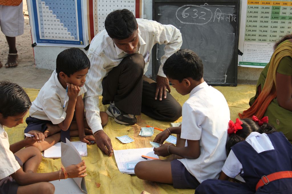 a teacher teaching school children