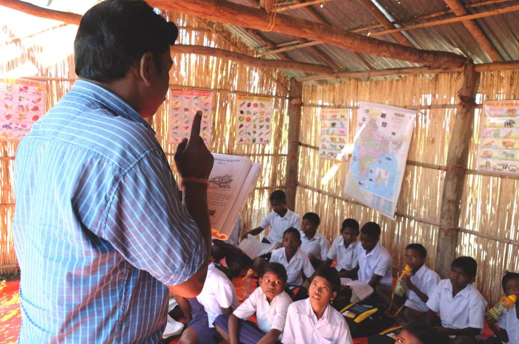 a man taking a class in a bamboo hut--edtech