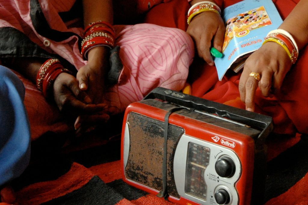 two pairs of hands and an old red radio--radio campaigns