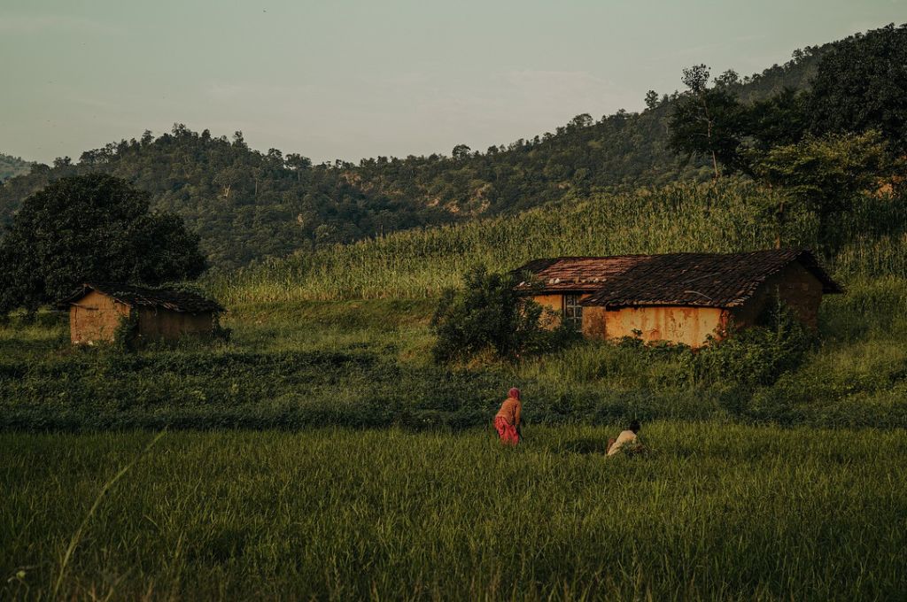 two women on a farm land in the mountains_climate change