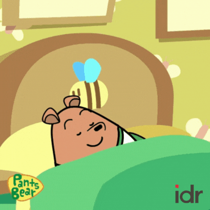 A bear sleeping in bed._nonprofit humour