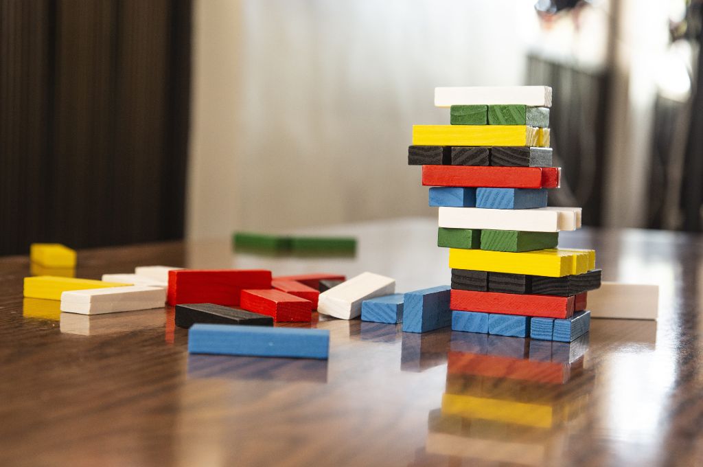 Jenga game wooden pieces lying on the table_people centric