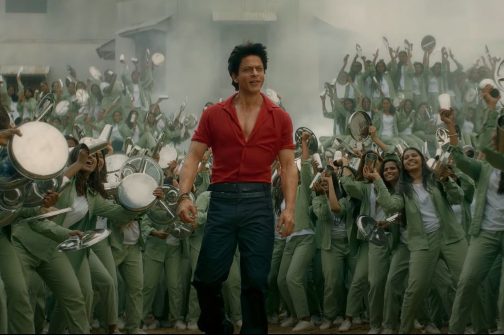 Bare-chested SRK sauntering through a group of women-Jawan