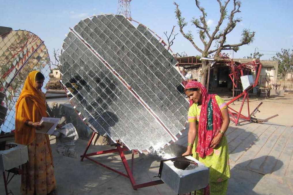 rural women making a solar energy machine-mitigation