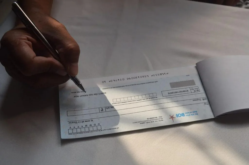 a person signing a cheque_fundraising