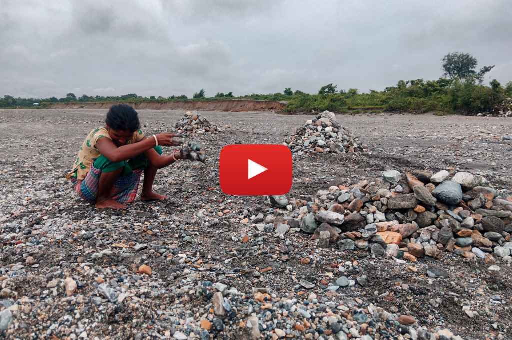 woman picking stones--sand and stone collectors