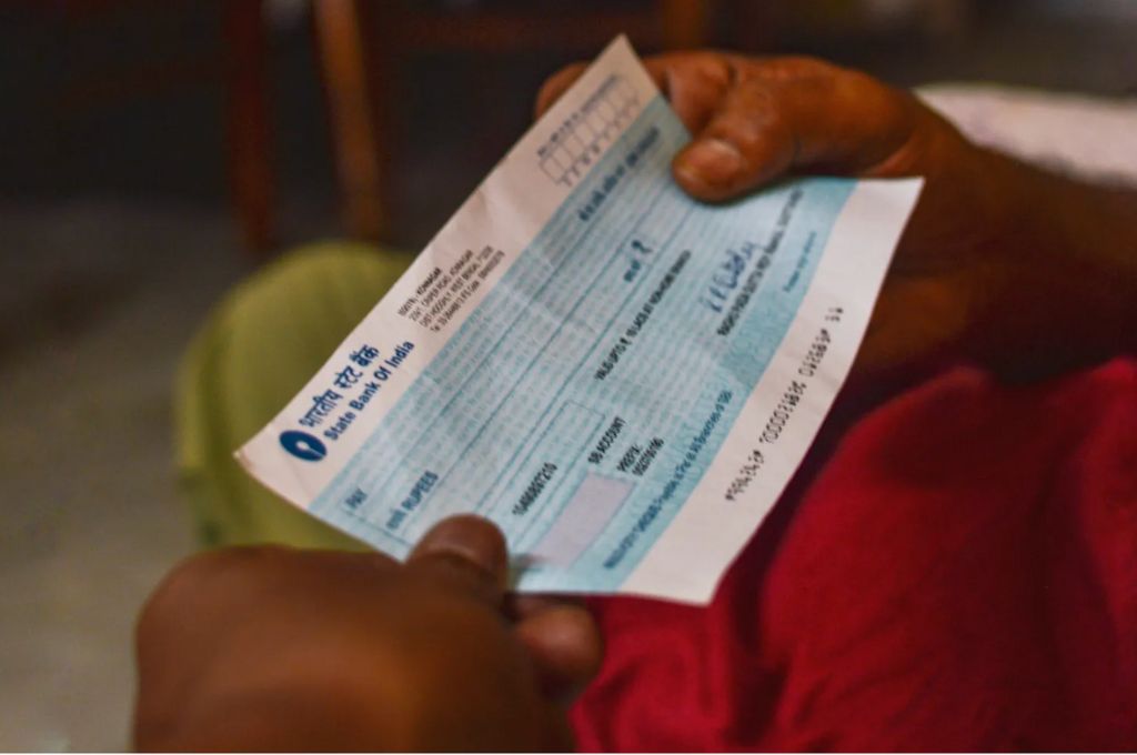 person holding a blank cheque-Philanthropy in India