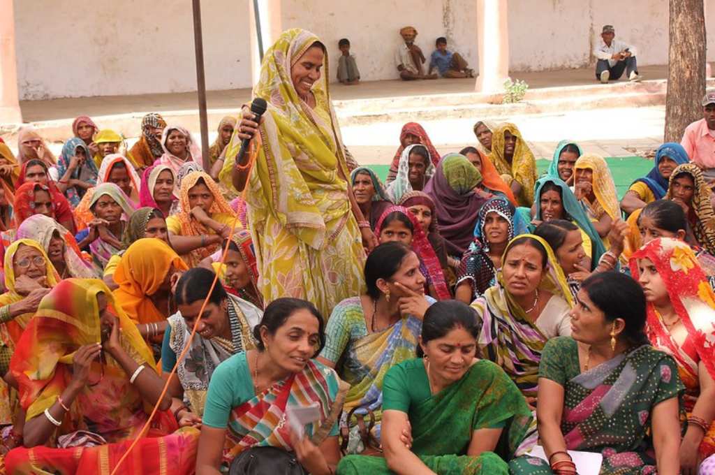 women sitting at a panchayat meeting-panchayati raj