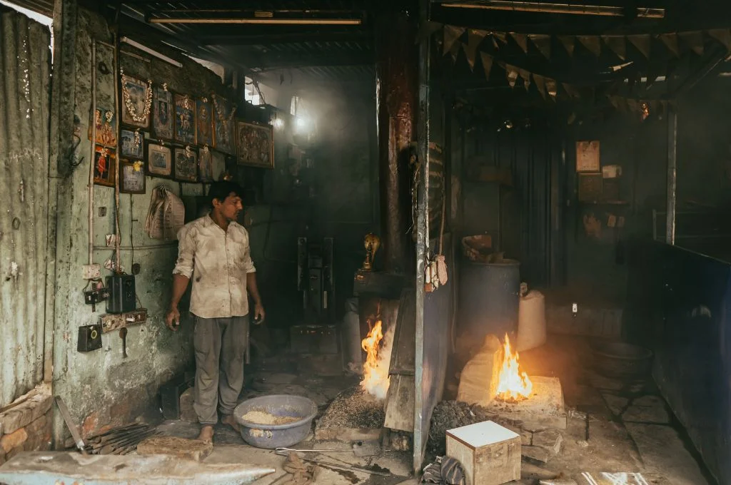 blacksmith standing in his workshop_heat stress
