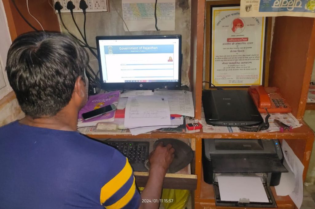 Chatar Singh working on a computer_emitra scheme