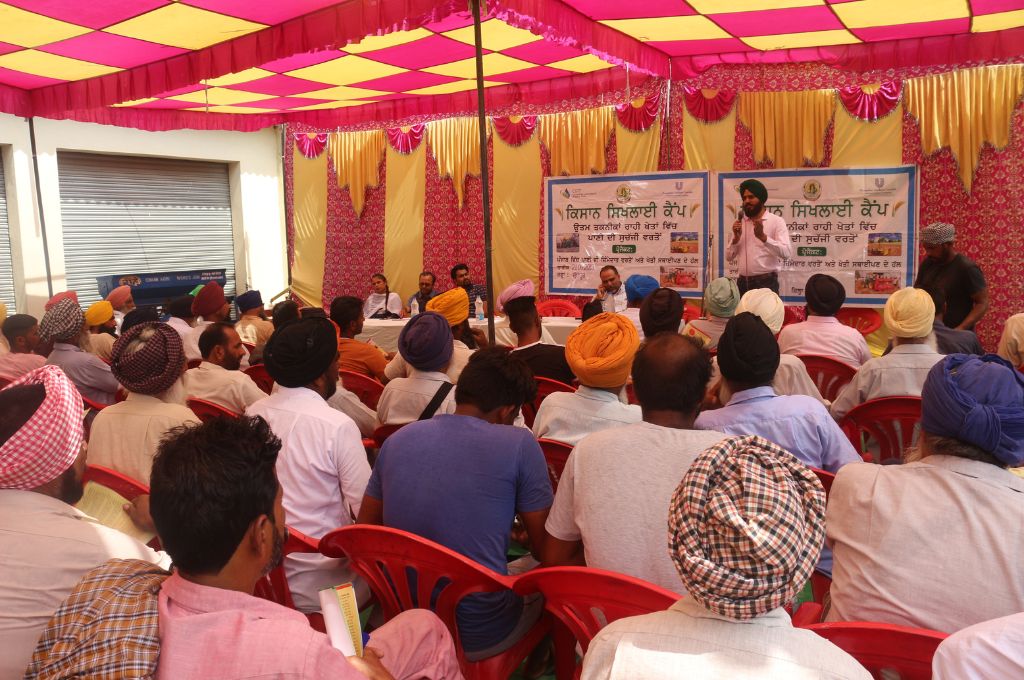Farmer and community members in Punjab participate in a meeting to discuss the implementation of agricultural practices that can enhance water conservation efforts_water crisis