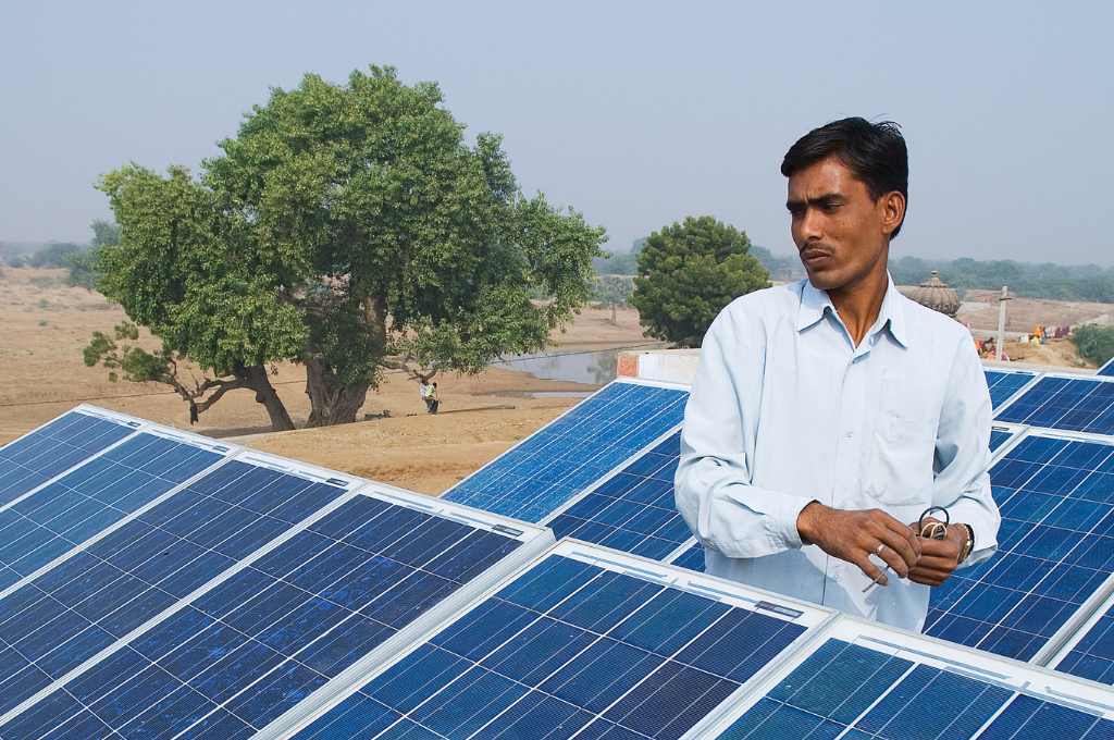 barefoot engineer repairing solar panel in ajmer, rajasthan--energy transition