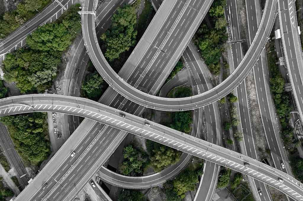 aerial photo of gray concrete roads intersecting--systems thinking