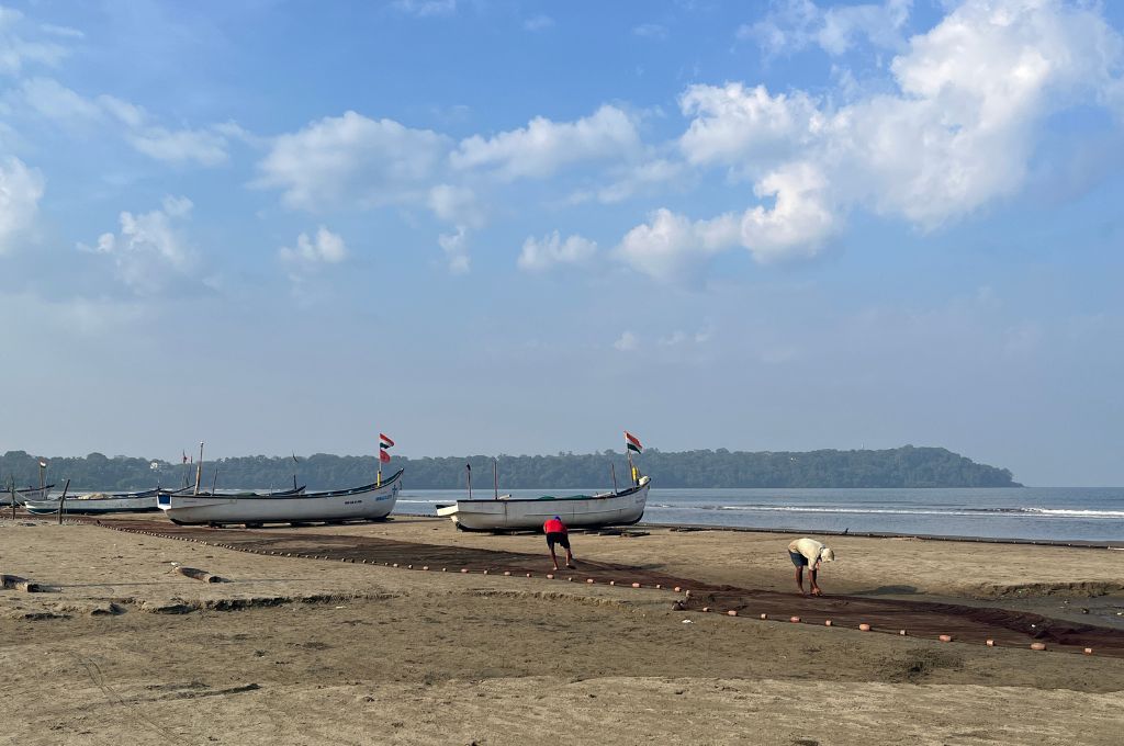 fishermen laying stone on a beach_coastal dunes
