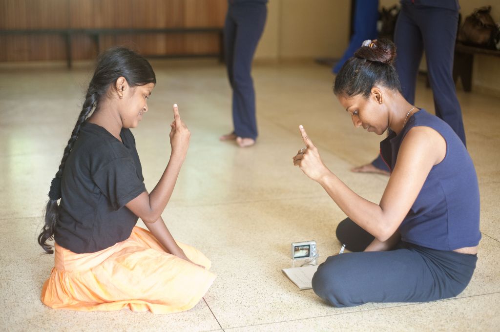 two girls communicating via sign language_disability law