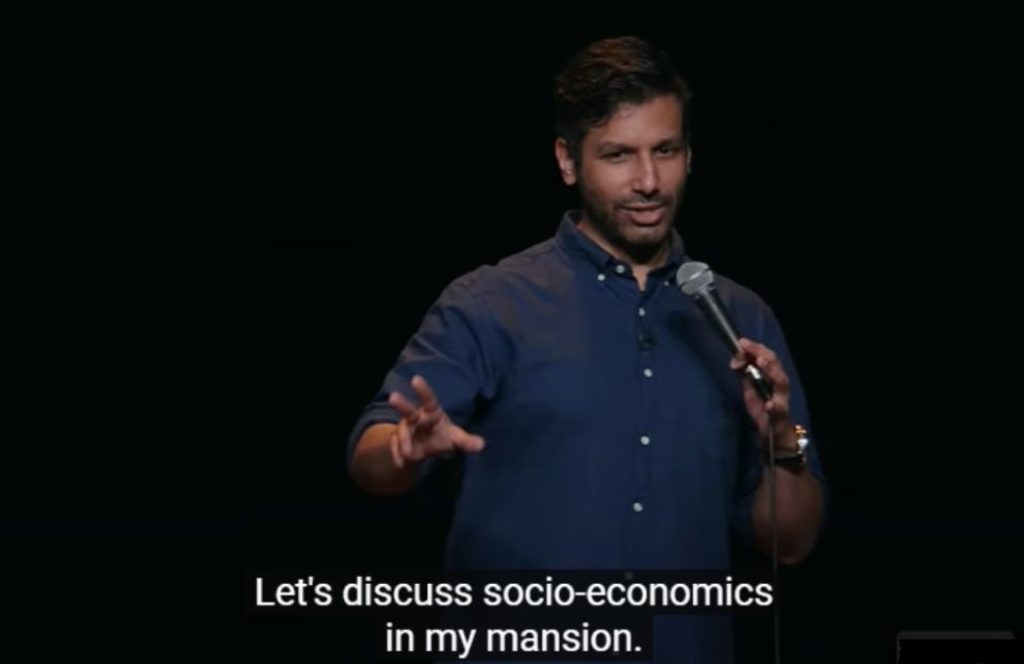 a comedian saying "Let's discuss socio-economics in my mansion"-nonprofit humour