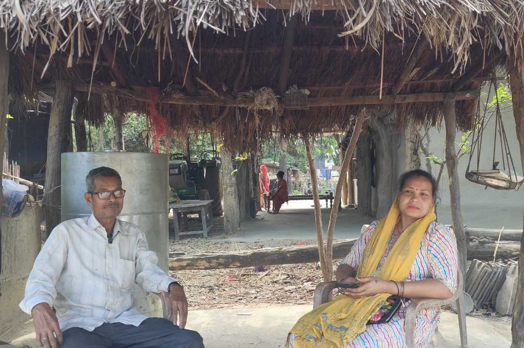 Ramchandra and Sahvaniya Rana sitting under a thatched roof-forest rights