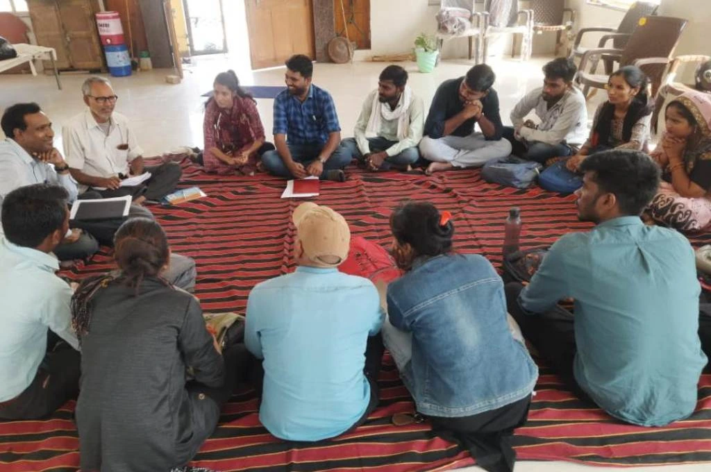 People sitting in a circle on the floor_language barrier to communication