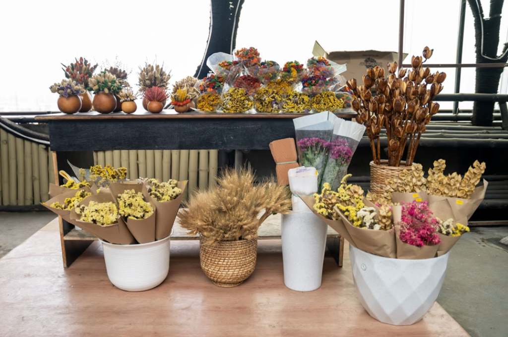 A stall adorned by dry flowers at the farmers’ market-dried flowers