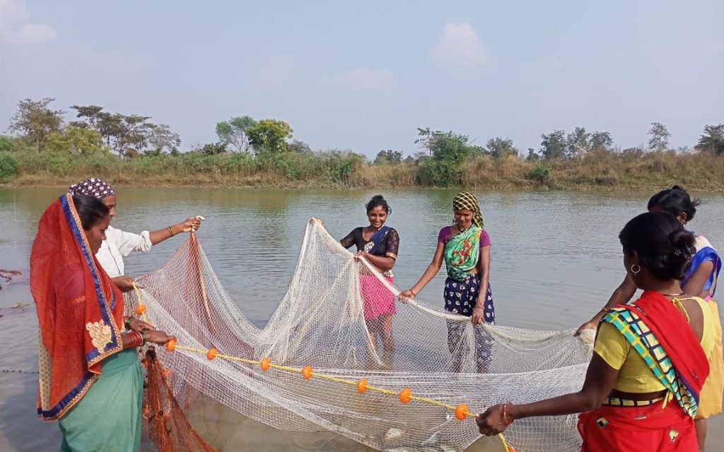 Women fishing in a pond they restored_women livelihood