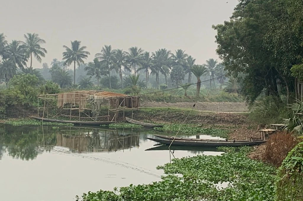 A fish net being dried in the wetlands.