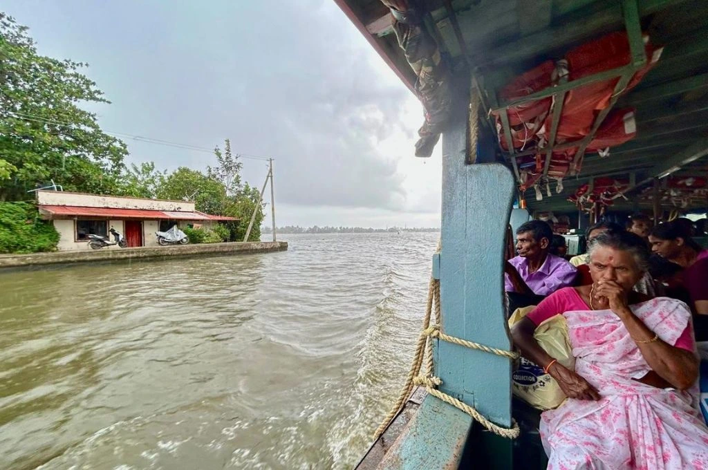 Women sitting inside a boat in Alappuzha, which has an intricate system of waterways that the ferries traverse_water transport