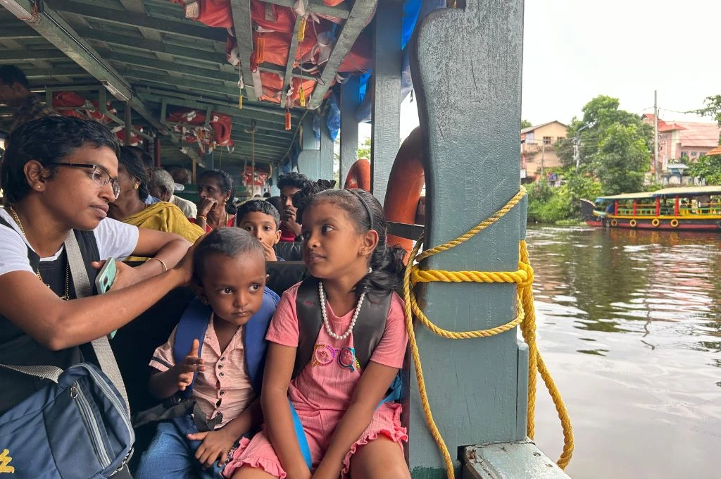 Children sitting in a boat_water transport