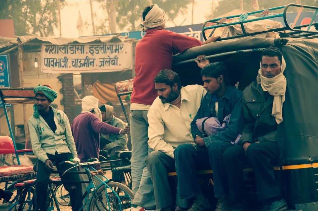 Workers sitting in an auto-rickshaw_migration