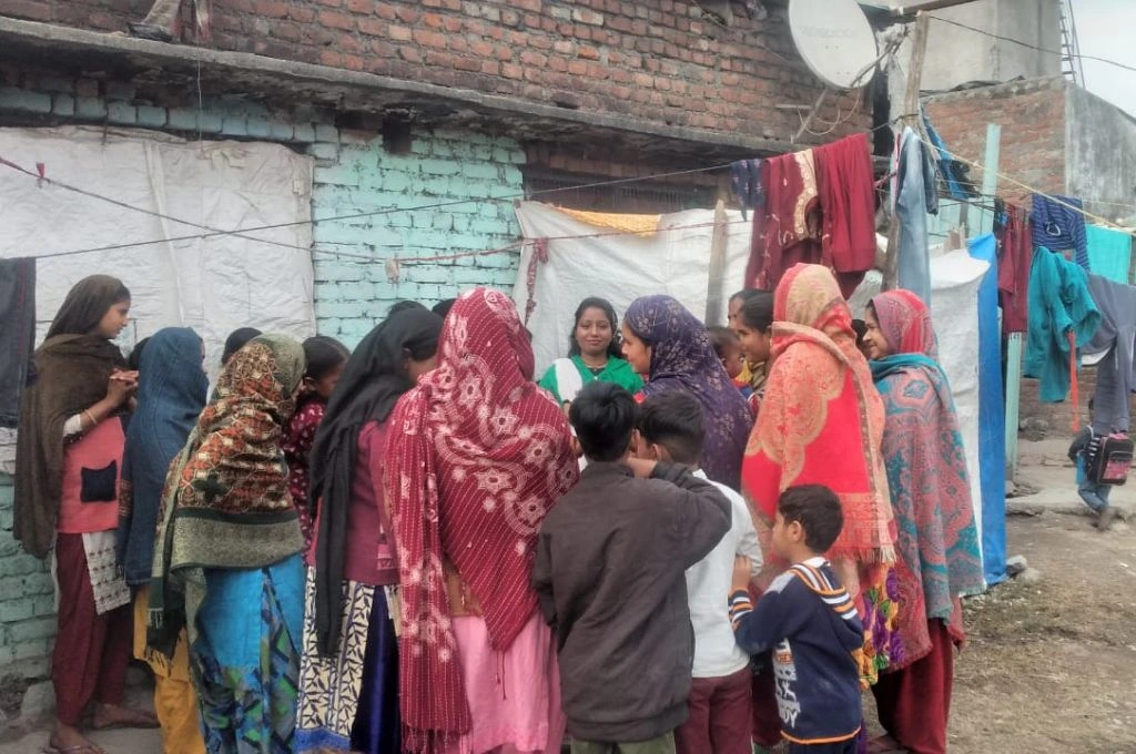 Women in a village standing in a group and talking_mental health stigma