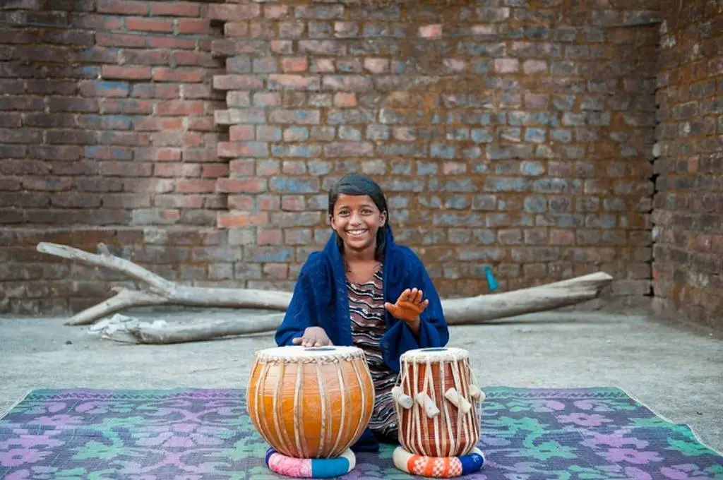 a girl playing the tabla-internship