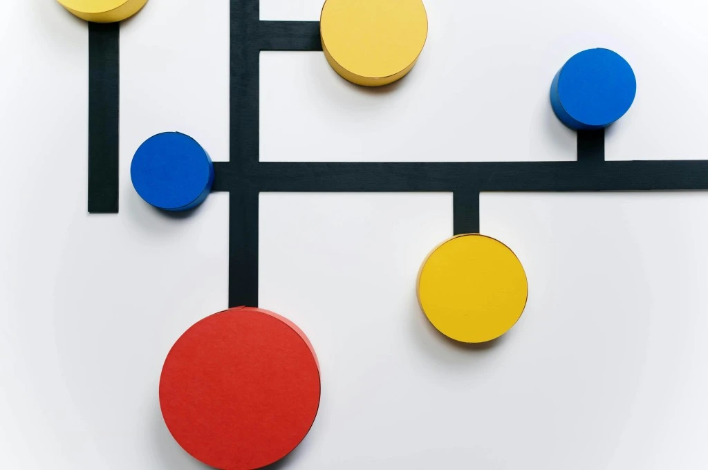 The image features colourful circular blocks that are placed at different points on perpendicular lines._Tech adoption