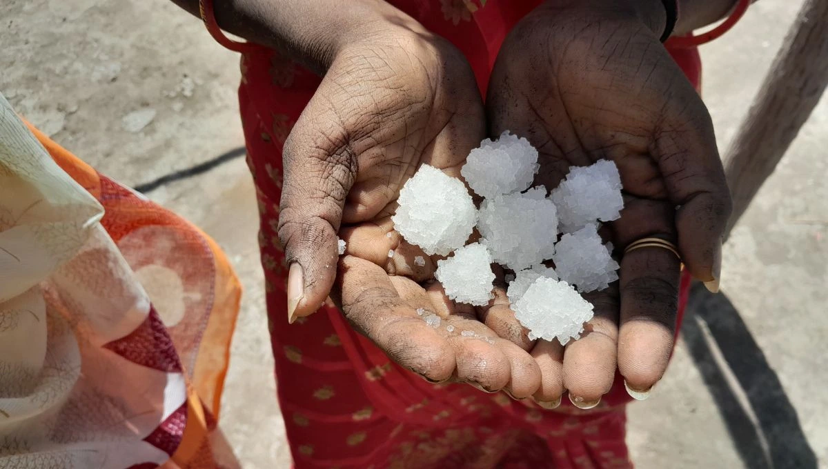Close-up shot of a woman's hands holding salt crystals--salt farming