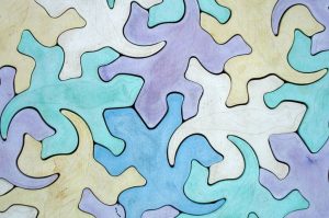 an abstract illustration of interlinking silhouettes of lizards-global collaboration