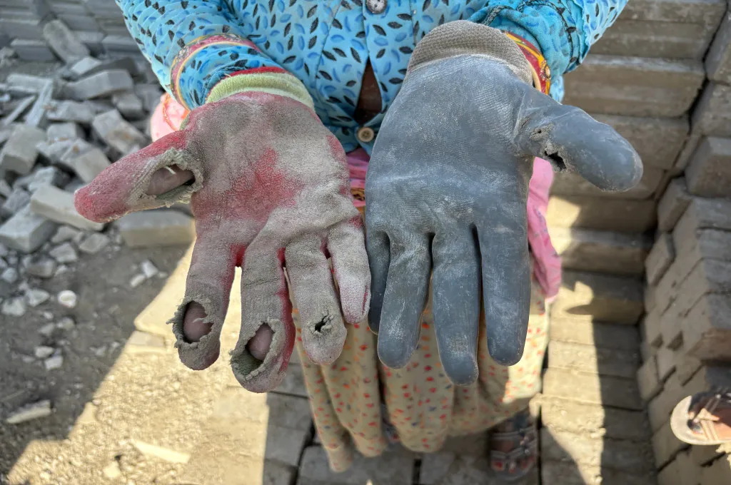 a close up shot of tattered gloves--fly ash